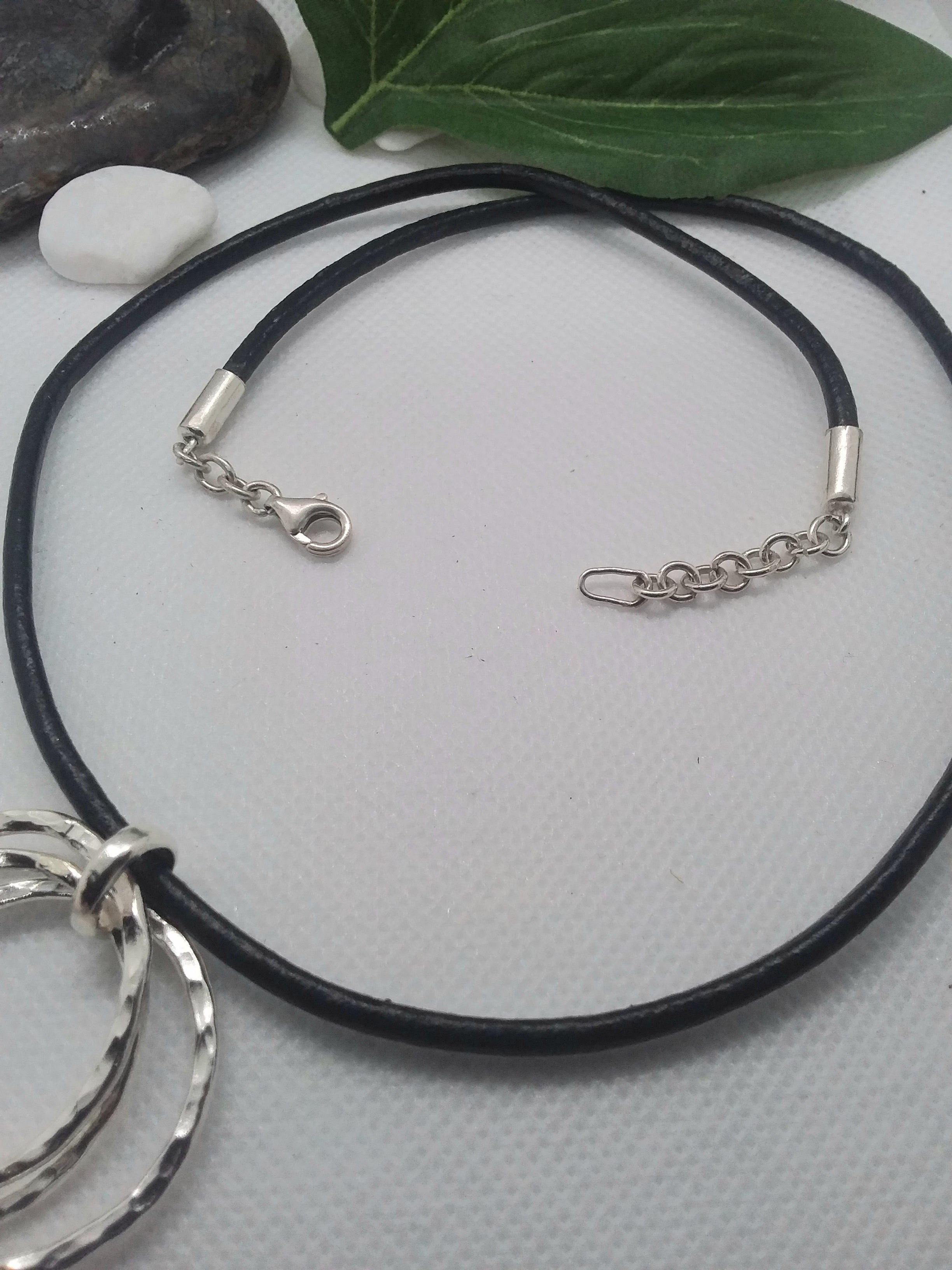 Sterling Silver three circle pendant with neoprene black neckpiece