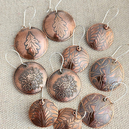 Etched copper earrings with botanical motif