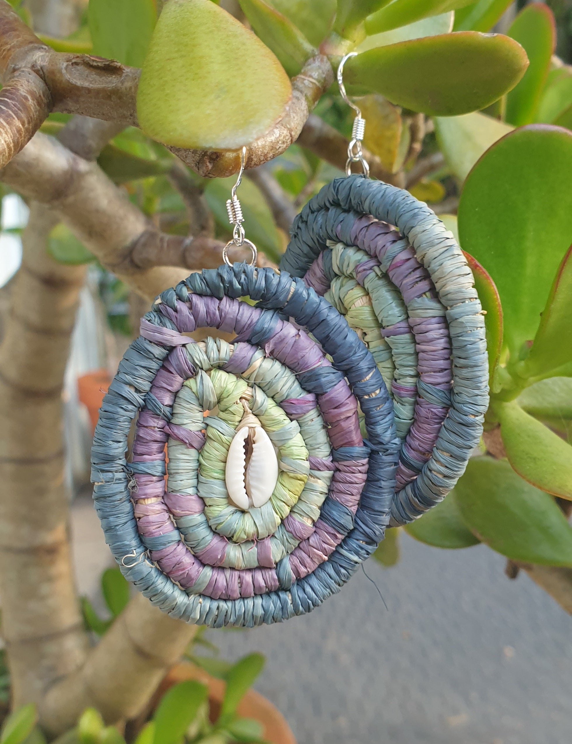 Handmade raffia, cowrie shell earrings.