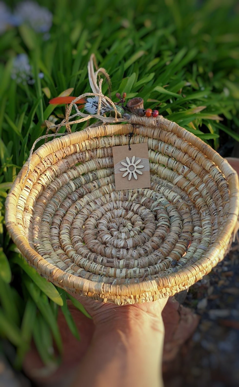 Handmade, natural fibre coil basket.