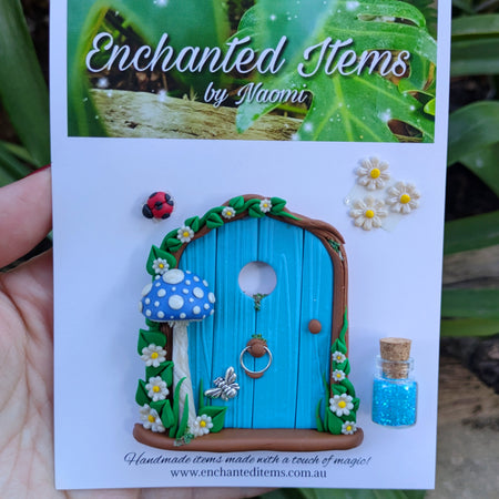 Mini Blue Fairy Door with a Mushroom, Flowers & Silver Bumblebee