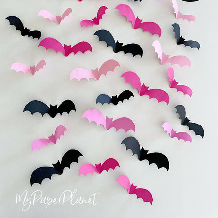 Halloween Bat shapes. Pink Black 3D bats, Spooky decorations.