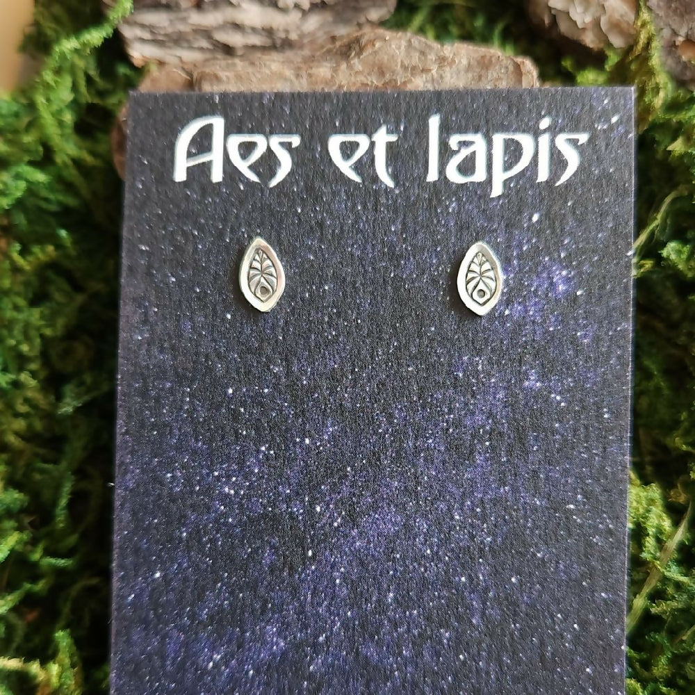 Tiny sterling silver studs with leafy pattern