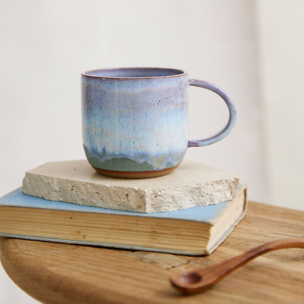 birdrock-ceramics-coastal-ceramic-mug-wide-handmade-ceramic-natural-clay-white-lavender-blue-purple-large-mug-home-decor-australian-coastal-ceramic-mug-wide-on-stool