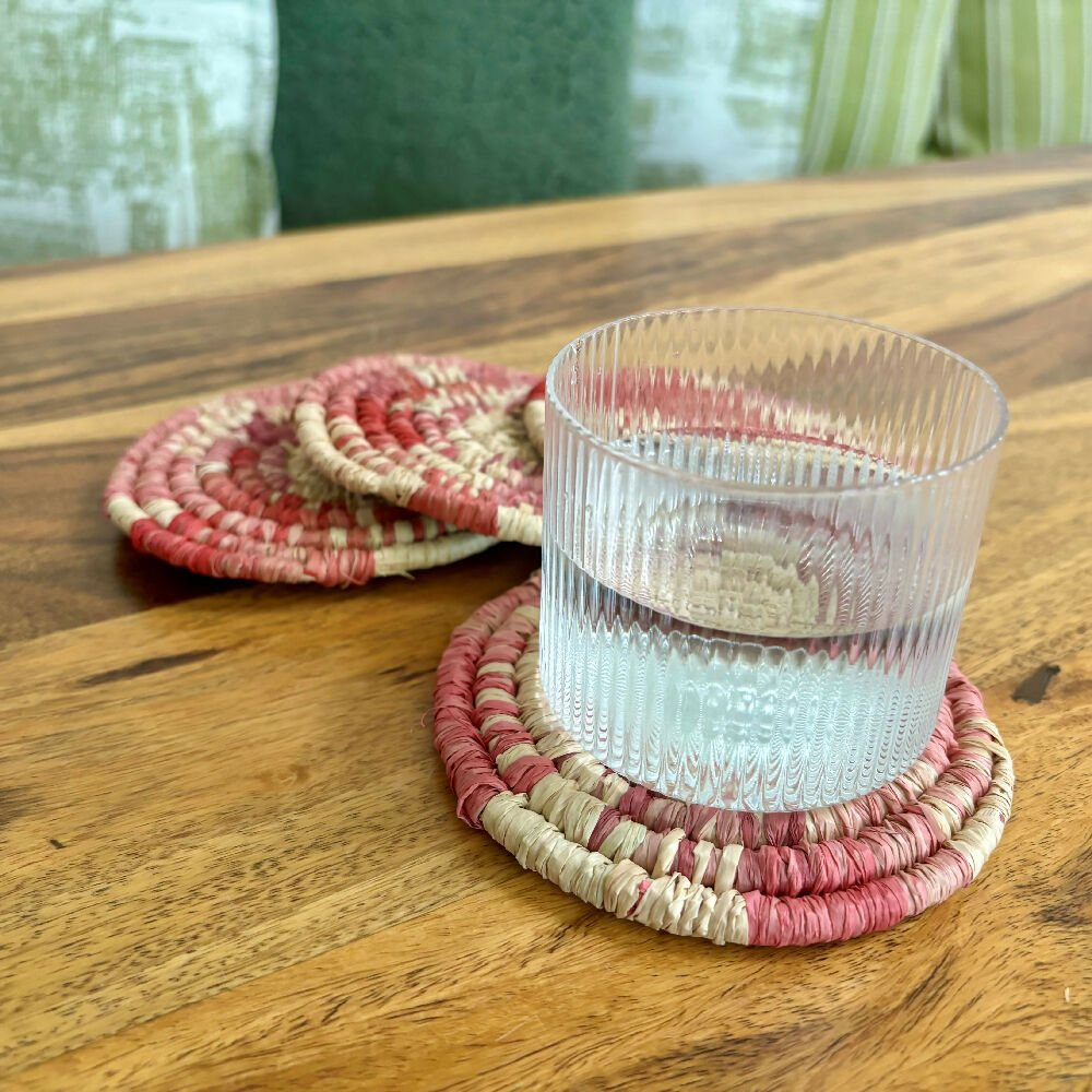 Handcrafted Raffia coasters with pink and red accents