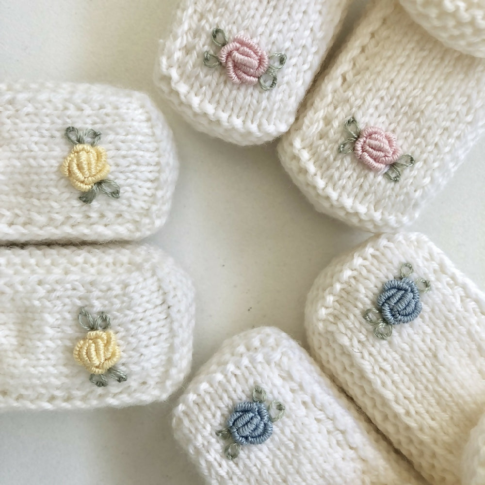 Hand-knitted baby booties with hand-embroidered rosebuds (Australian merino wool)