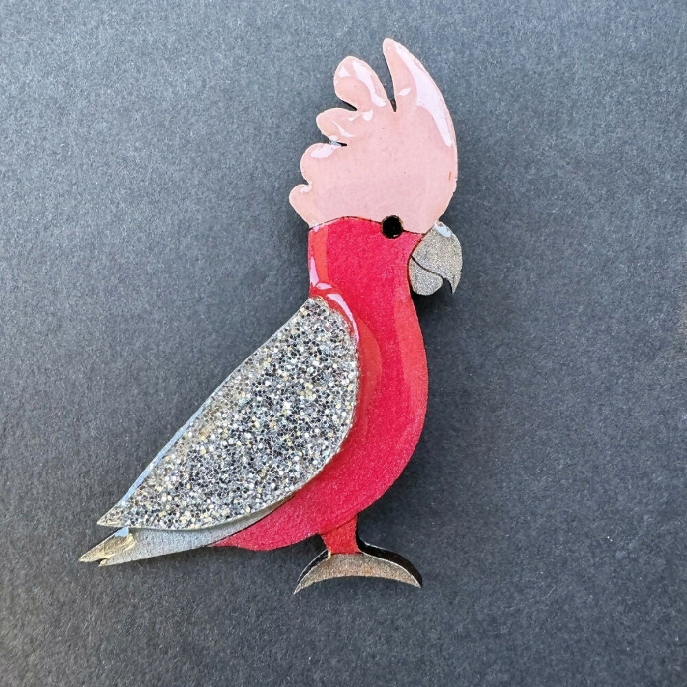 Australian-handmade-galah-brooch-wood-glitter-resin-on-grey-background-square