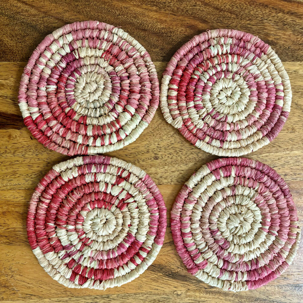 Handcrafted Raffia coasters with pink and red accents