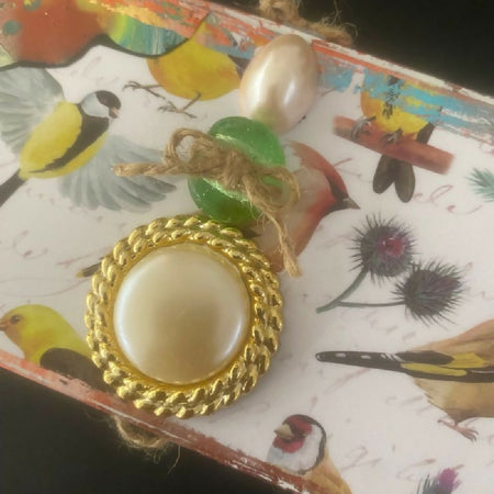 It’s a really good box! Birds, daffodils, and bead embellishments