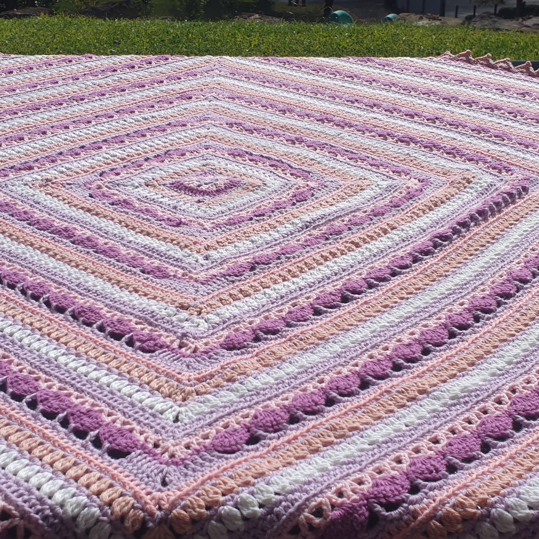 Beautiful crochet cotton afghan in pink/lilacs