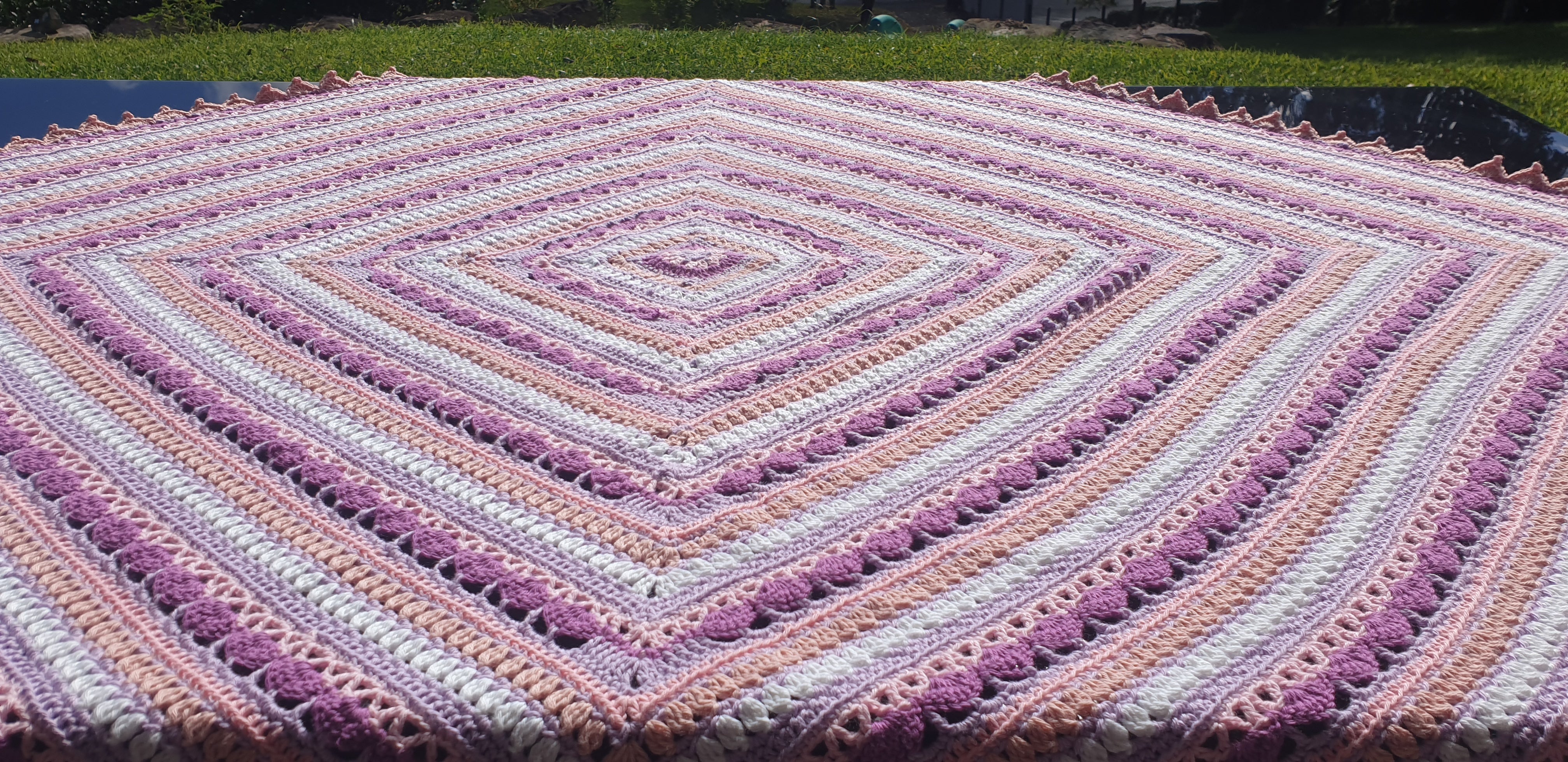 Beautiful crochet cotton afghan in pink/lilacs