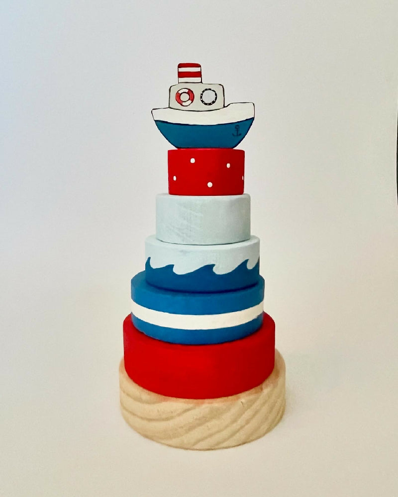 Ring stacker with boat topper.