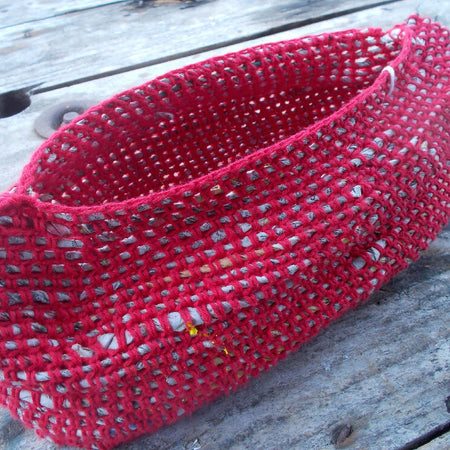 Crocheted basket made from cotton and newspaper yarns