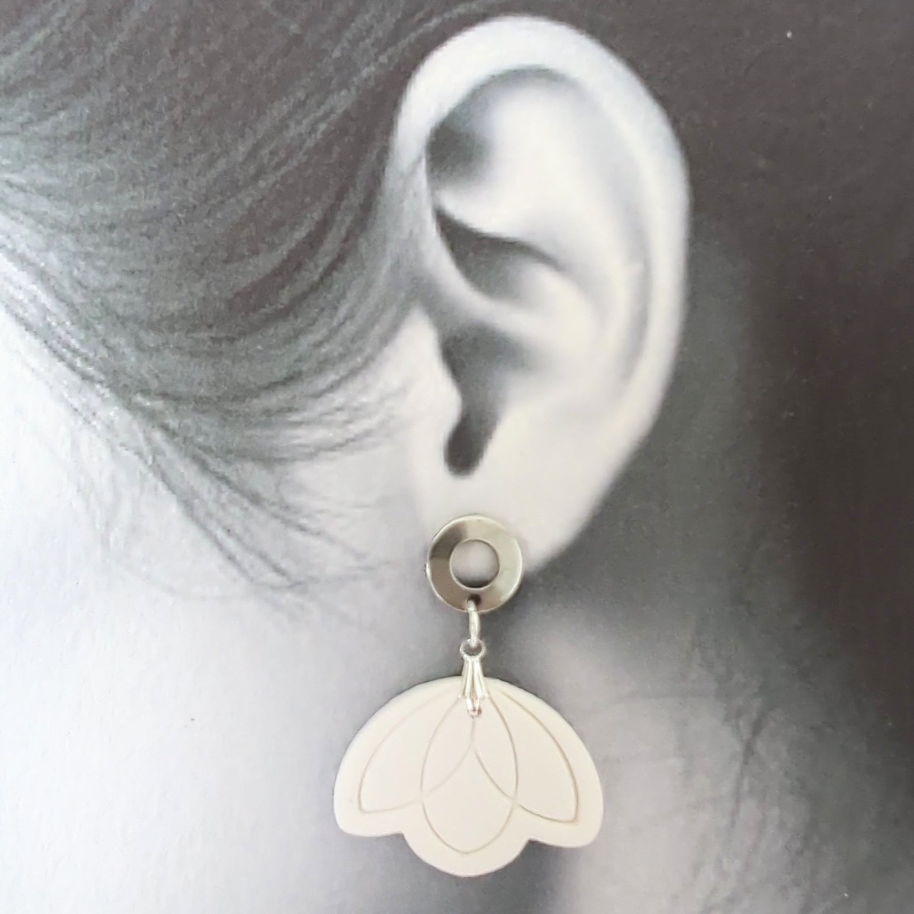 White Earrings with Silver in Different Designs.