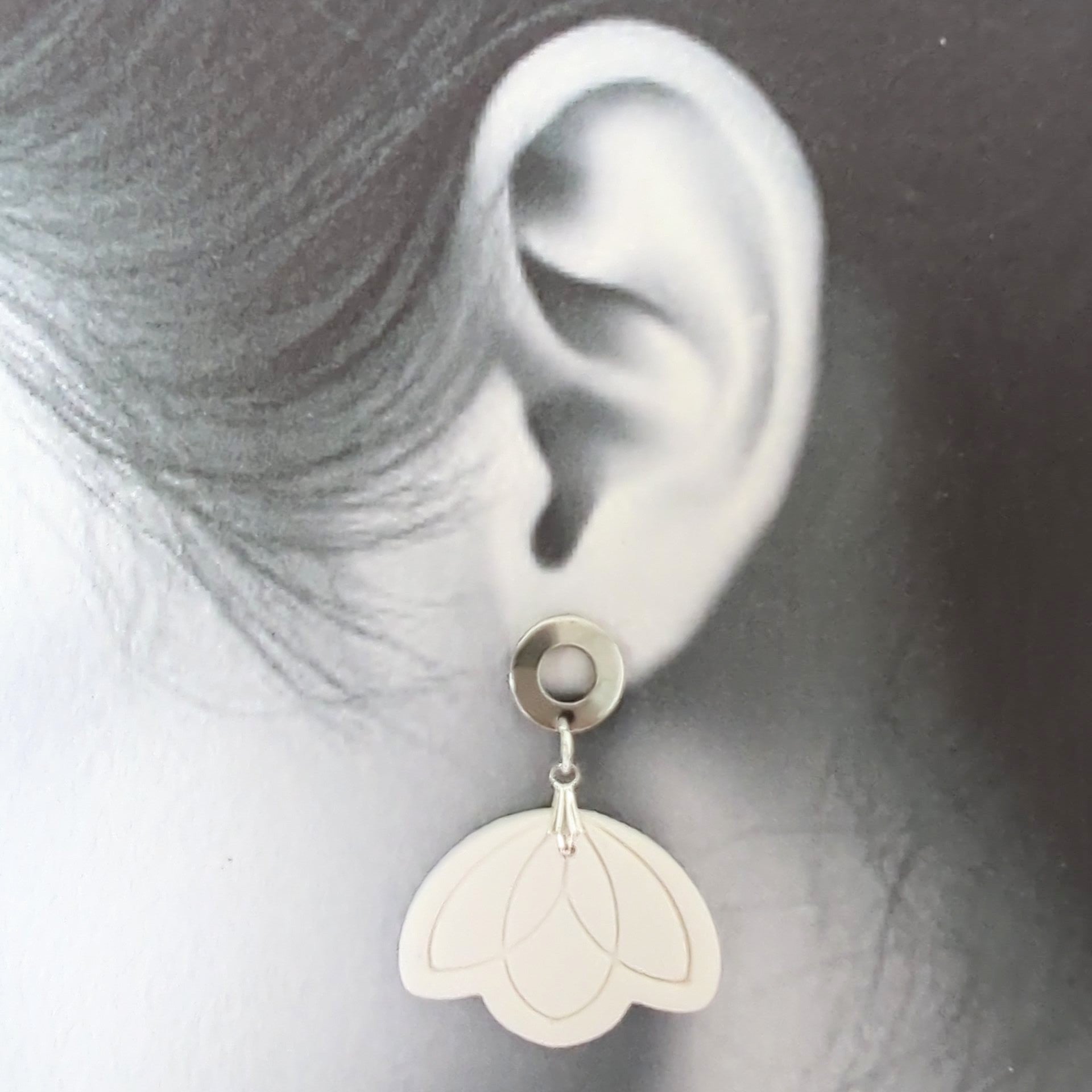 White Earrings with Silver in Different Designs.
