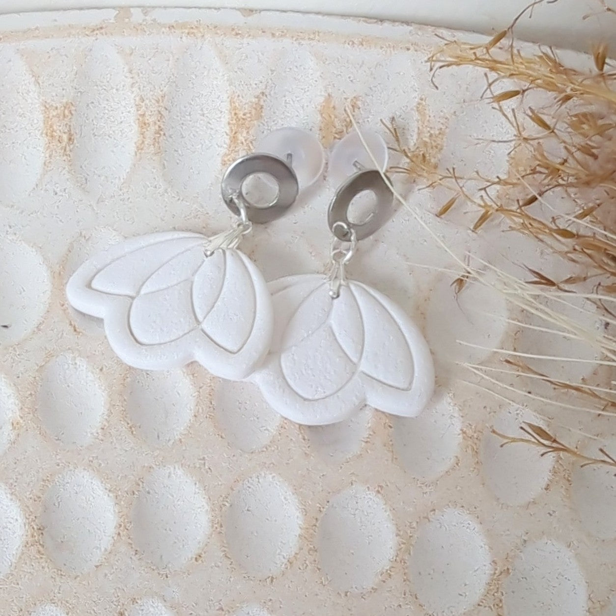White Earrings with Silver in Different Designs.