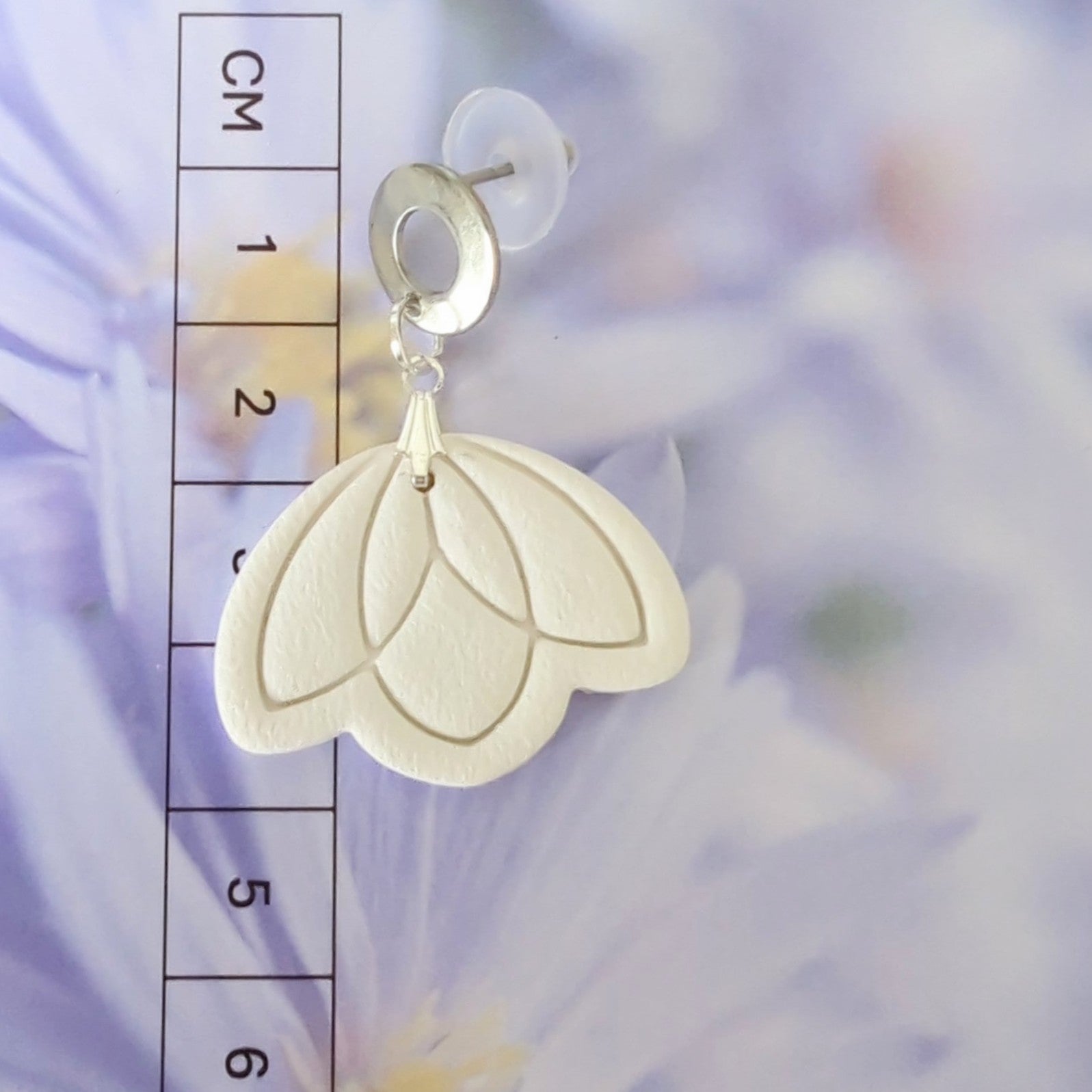 White Earrings with Silver in Different Designs.