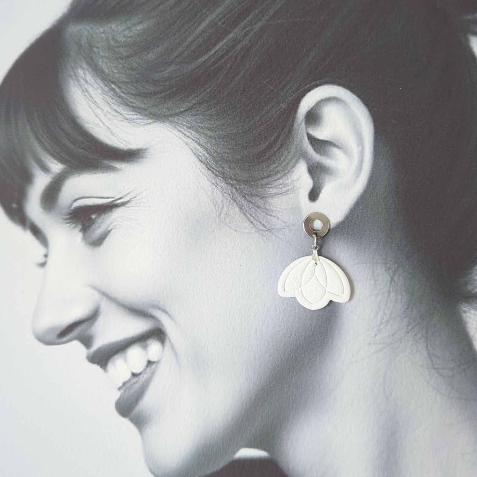 White Earrings with Silver in Different Designs.