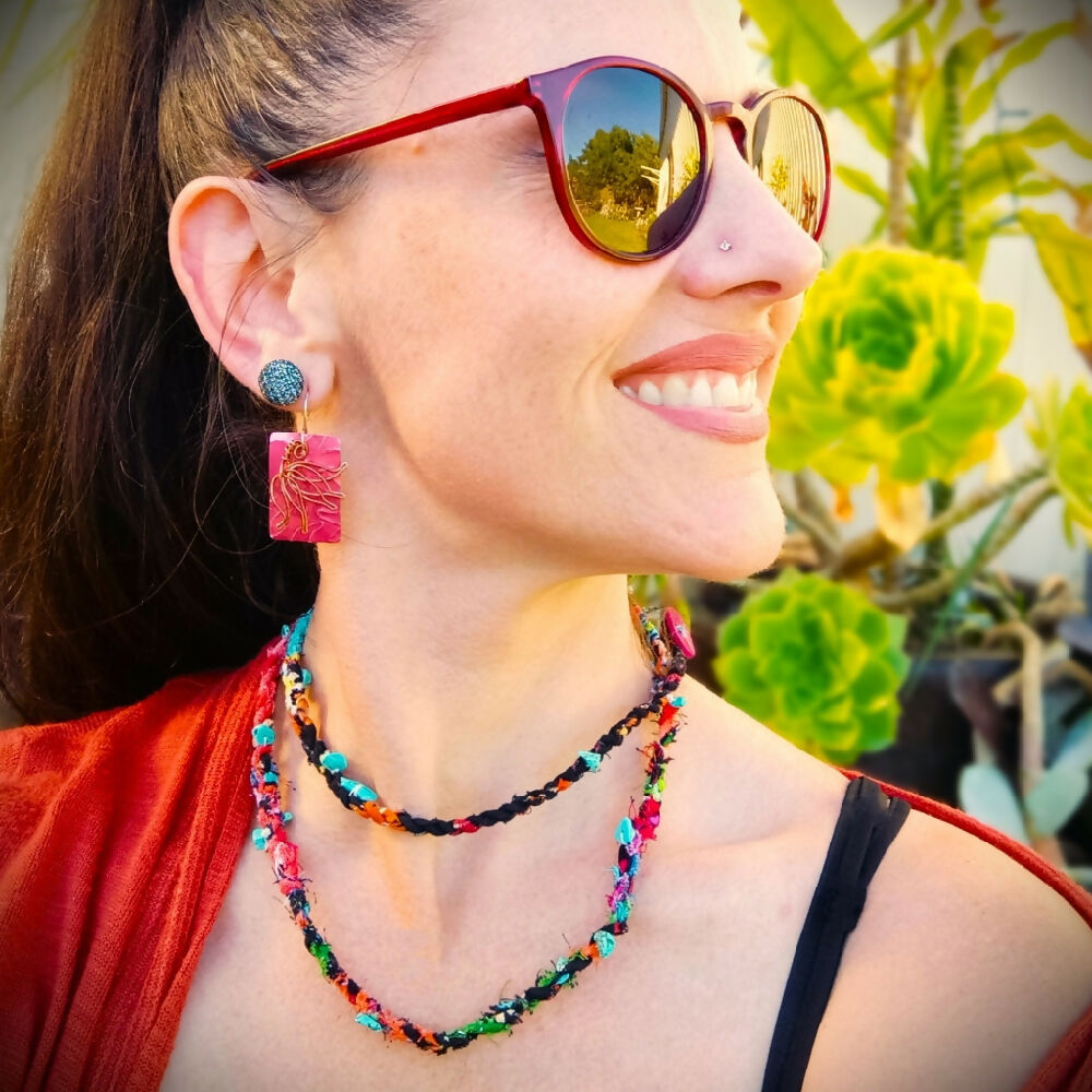 earrings and necklace being worn -