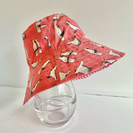 Summer hat in cool funky cockatoo fabric (coral)