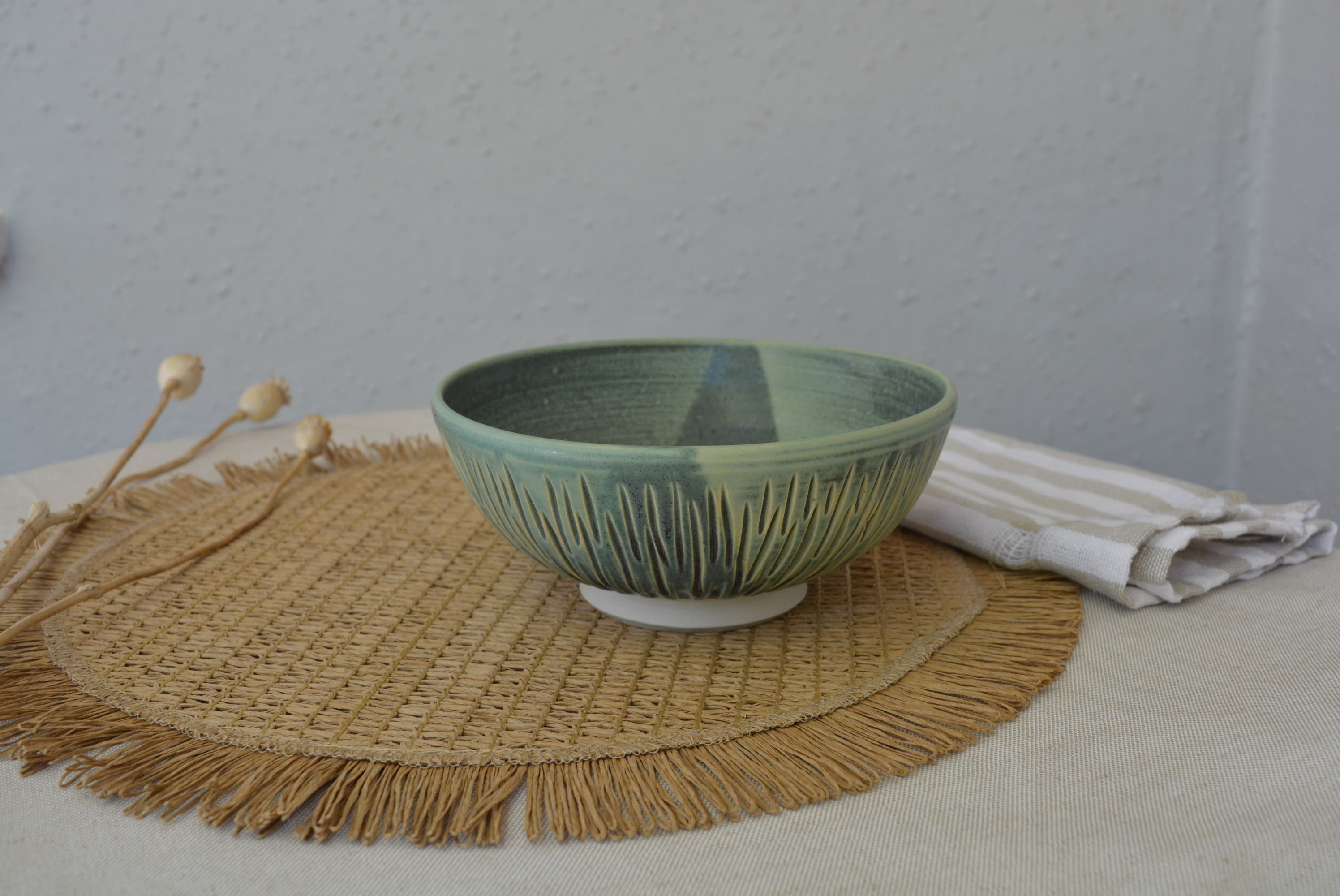 Handmade carved wheel thrown pottery bowl