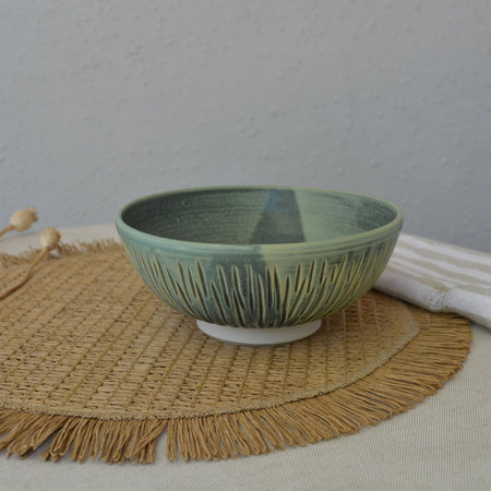 Handmade carved wheel thrown pottery bowl