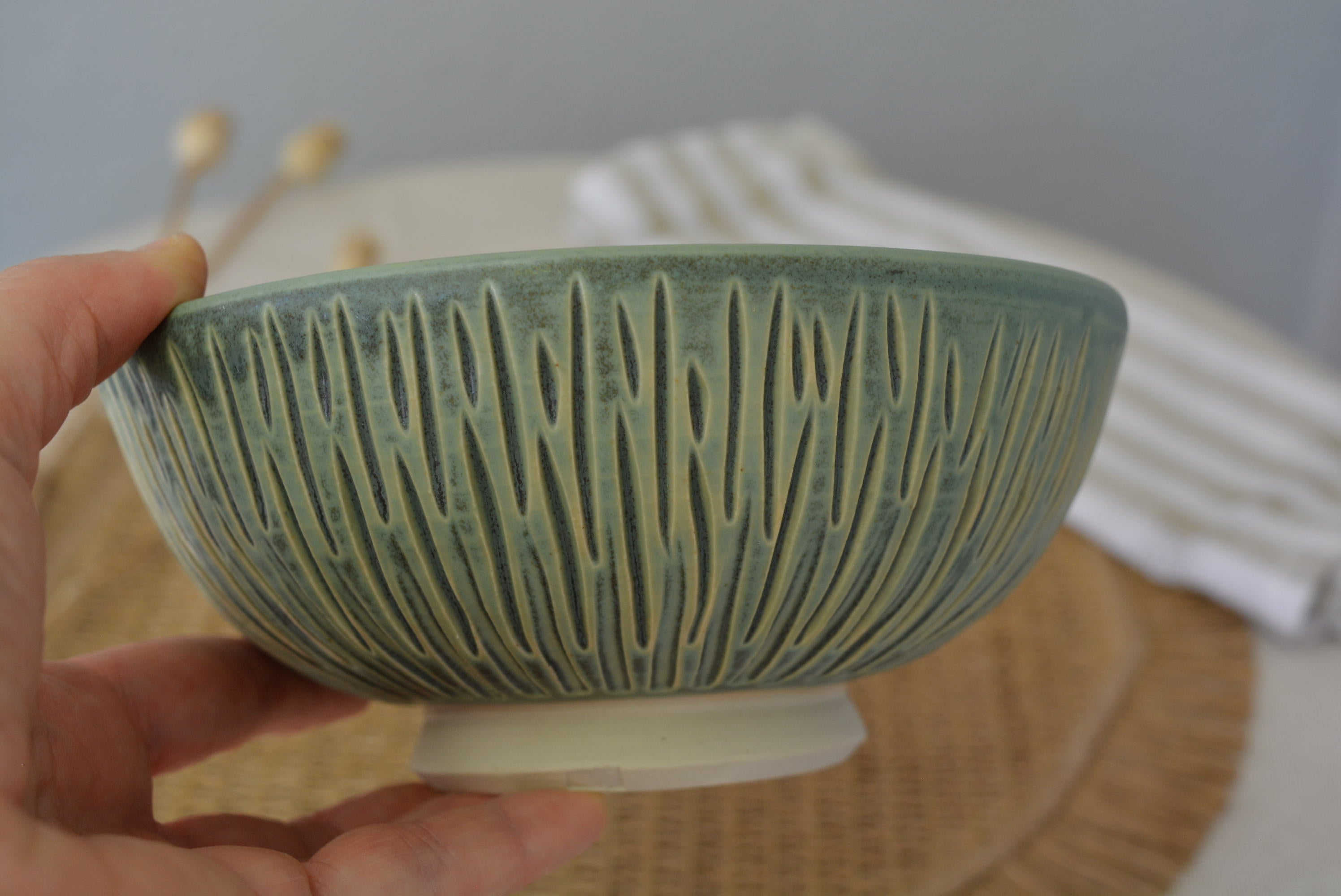 Handmade carved wheel thrown pottery bowl