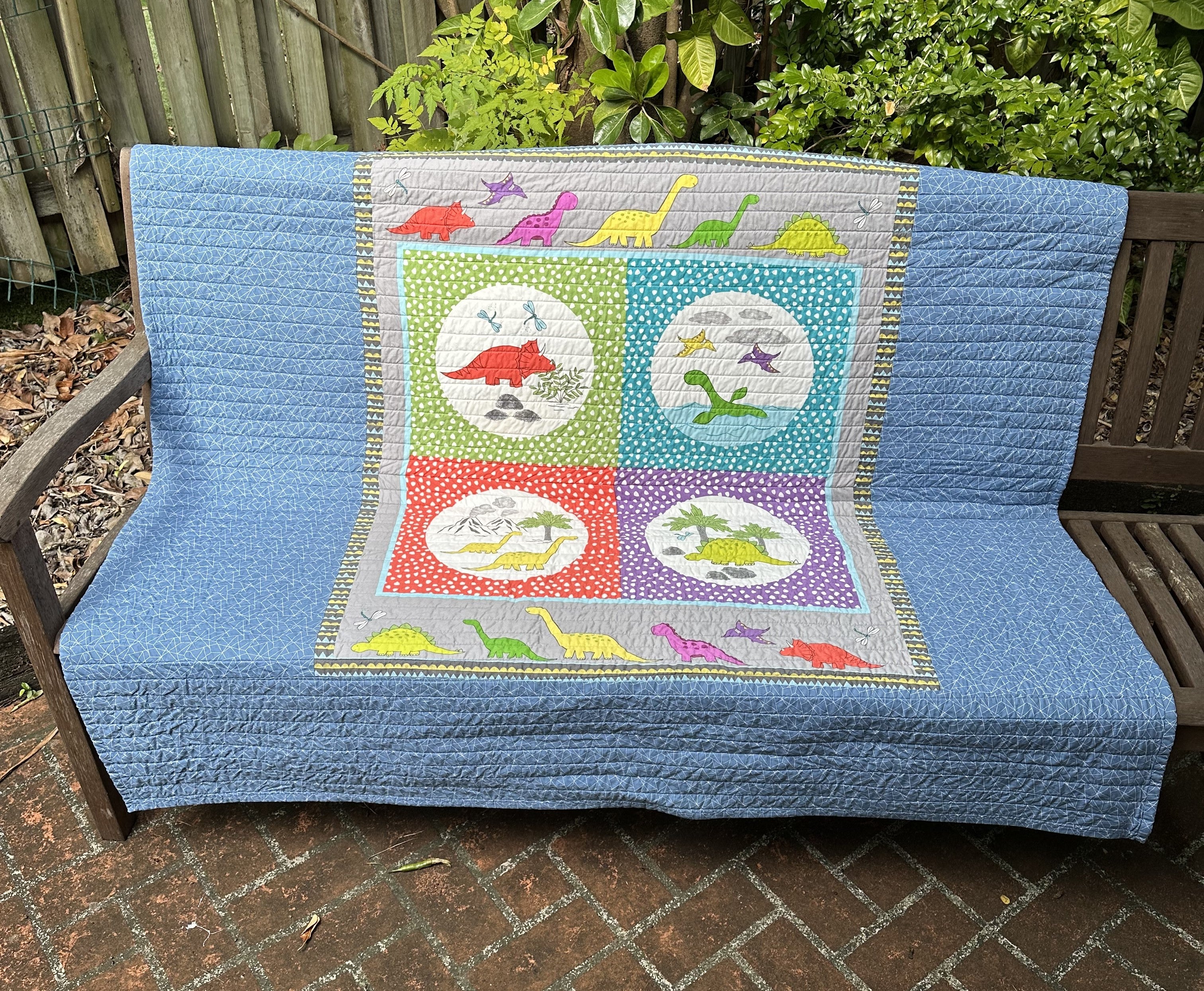 Striped Childrens' Quilt with Dinosaur Panel Backing