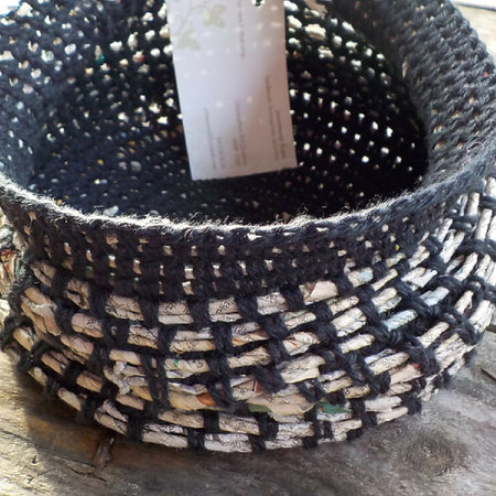 Crocheted basket made from cotton and newspaper yarns