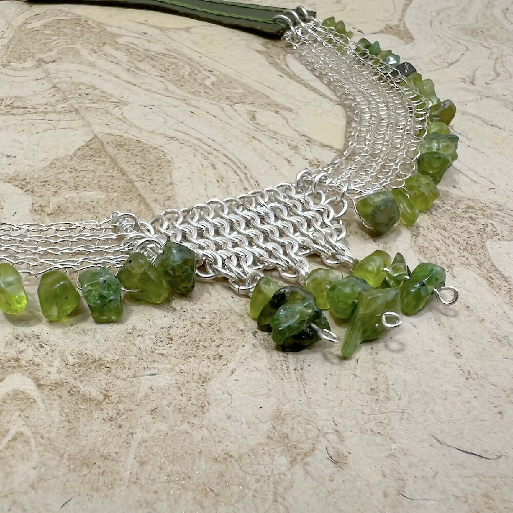 Knitted fine silver with peridot and leather necklace detail