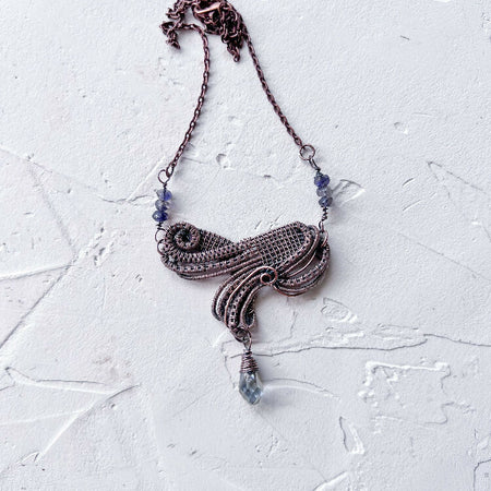 Sophisticated Wire Woven Pendant with Iolite Accents