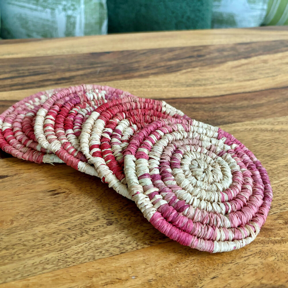 Handcrafted Raffia coasters with pink and red accents