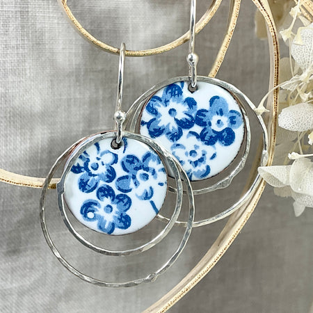 Argentium hoops with blue flower discs. Handmade earrings