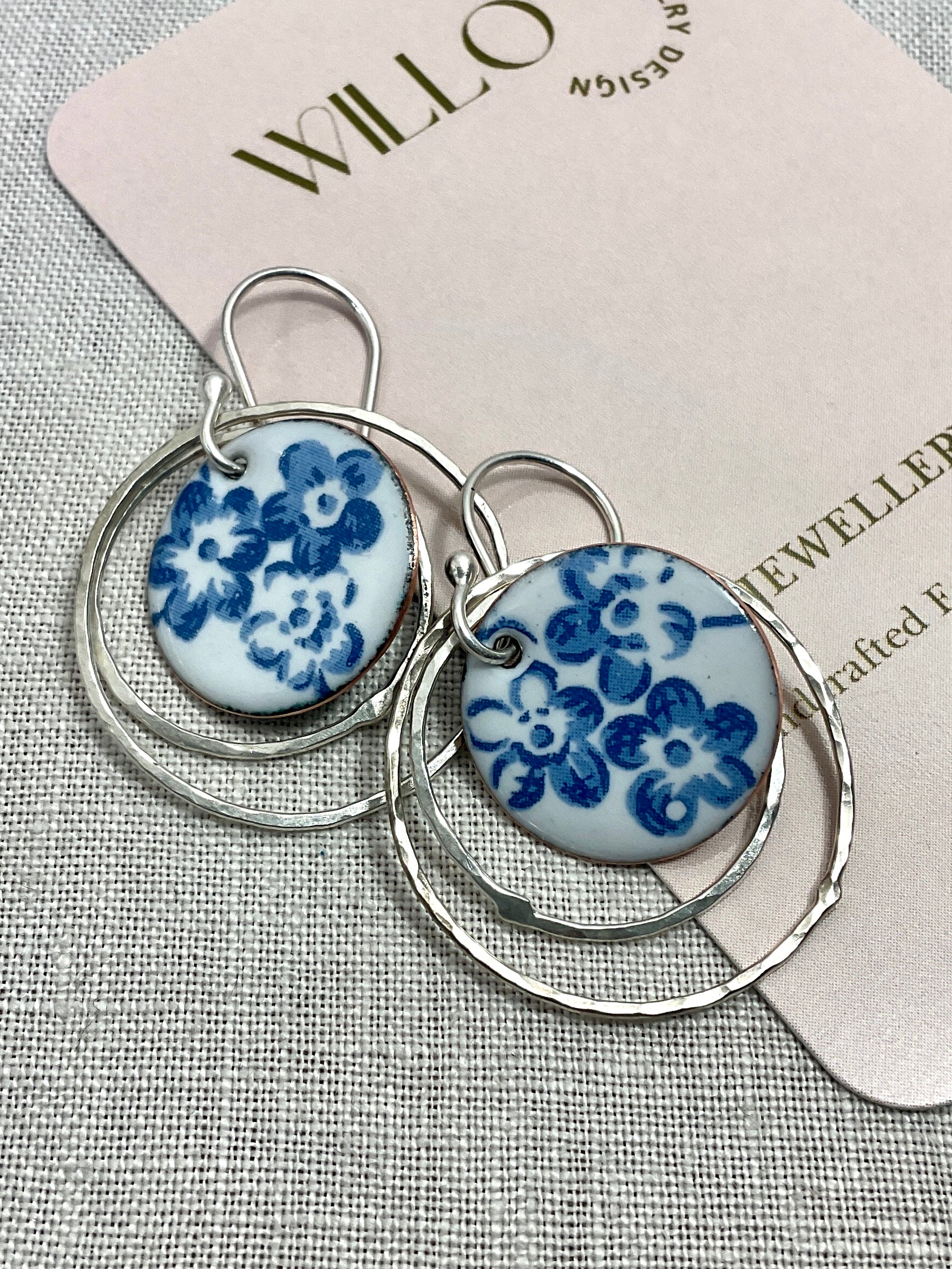 Argentium hoops with blue flower discs. Handmade earrings