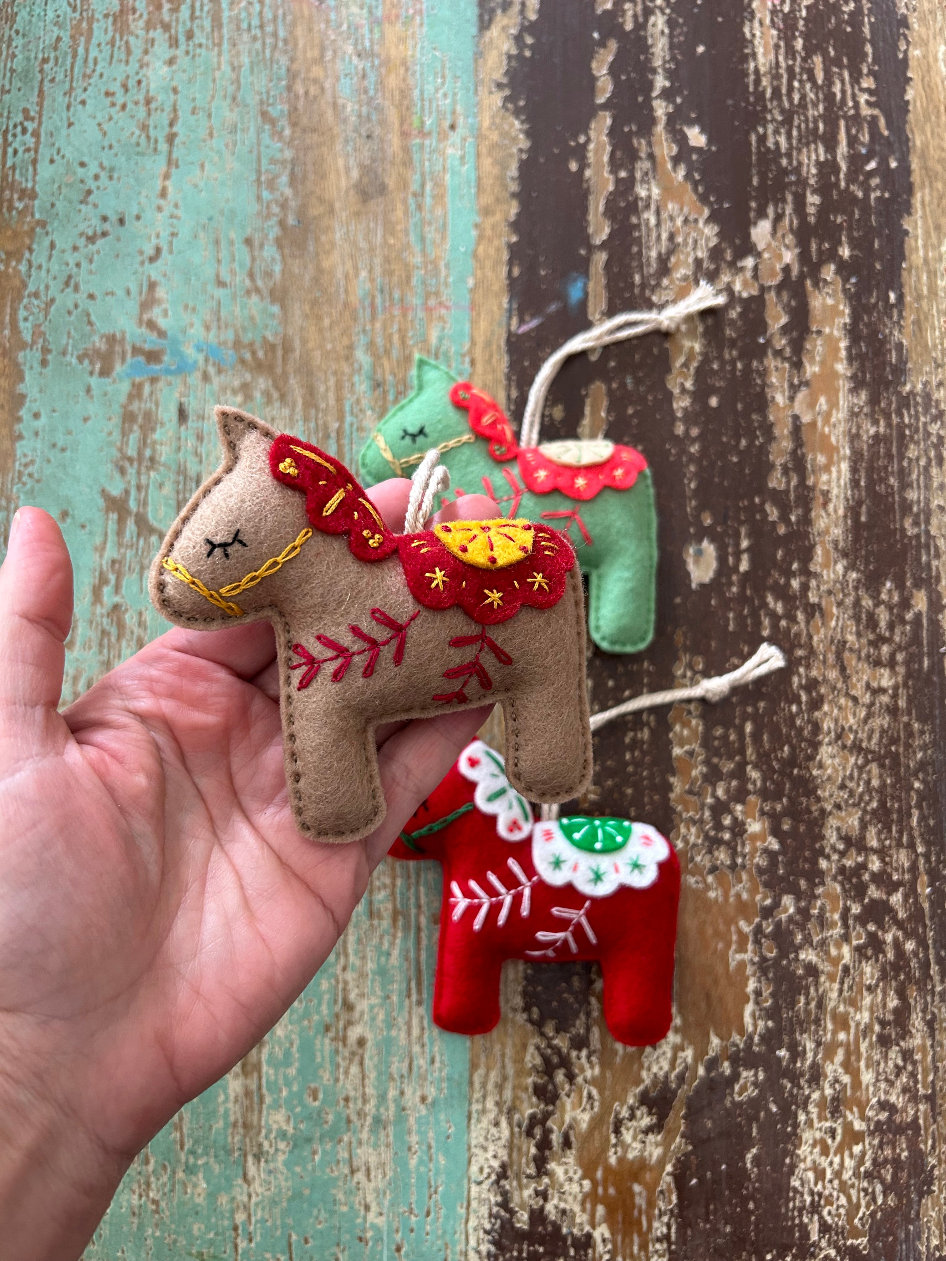 Scandinavian-inspired Dala horse ornament, hand embroidered for timeless holiday charm