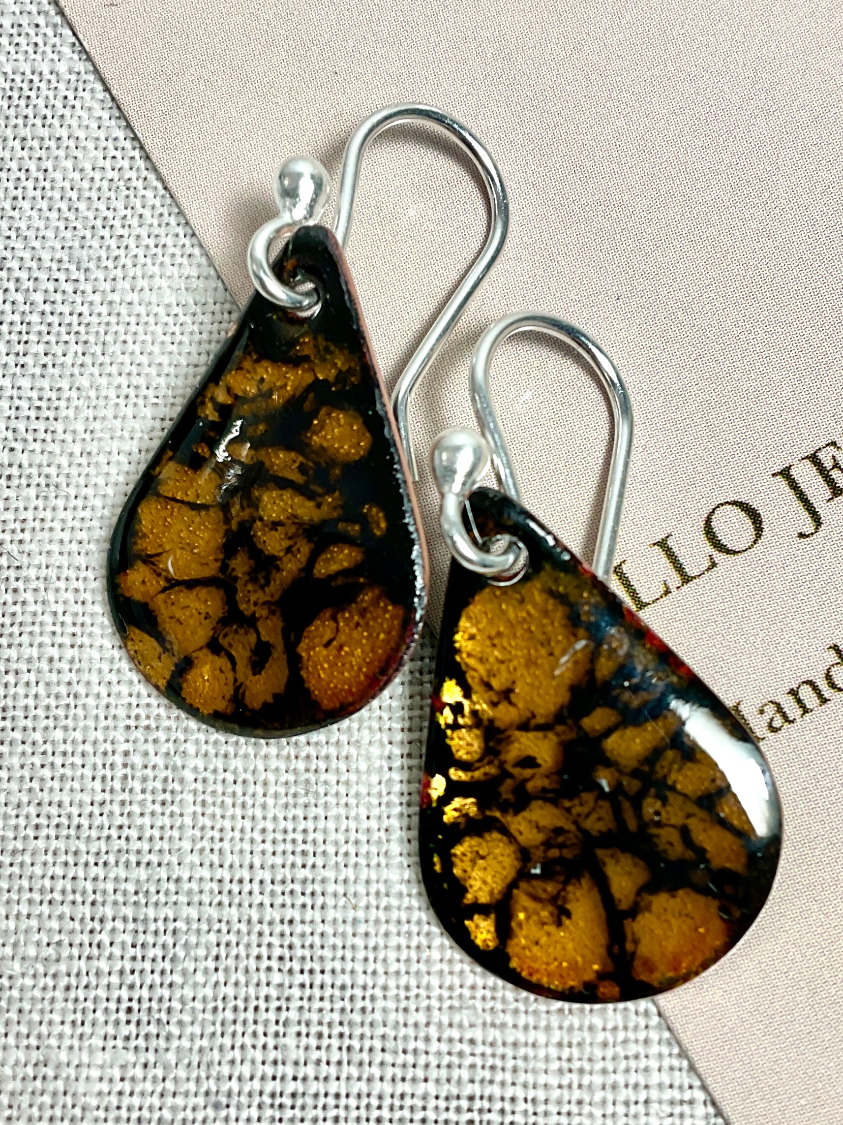 Gold teardrop enamel earrings