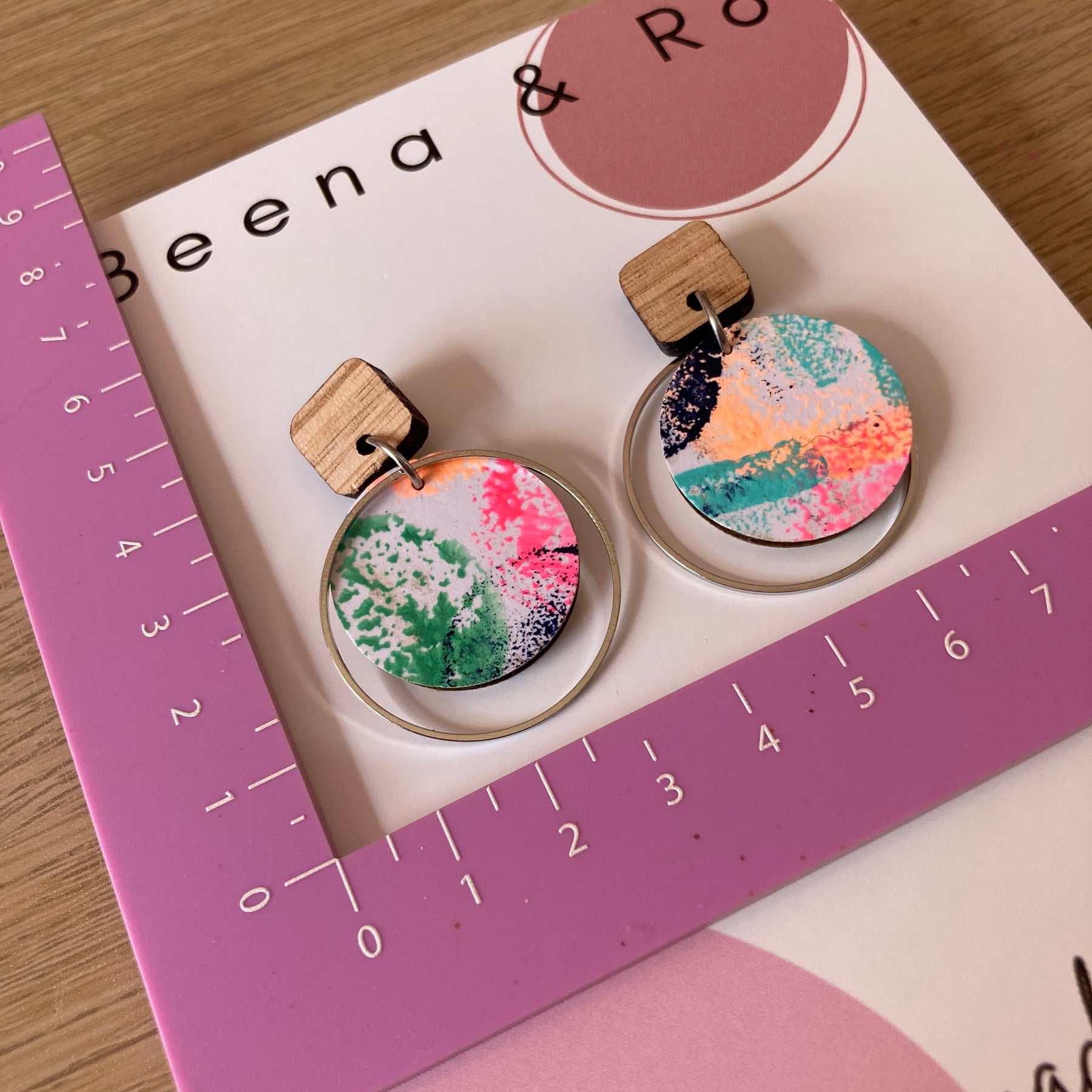 Handpainted earrings with circle embellishment
