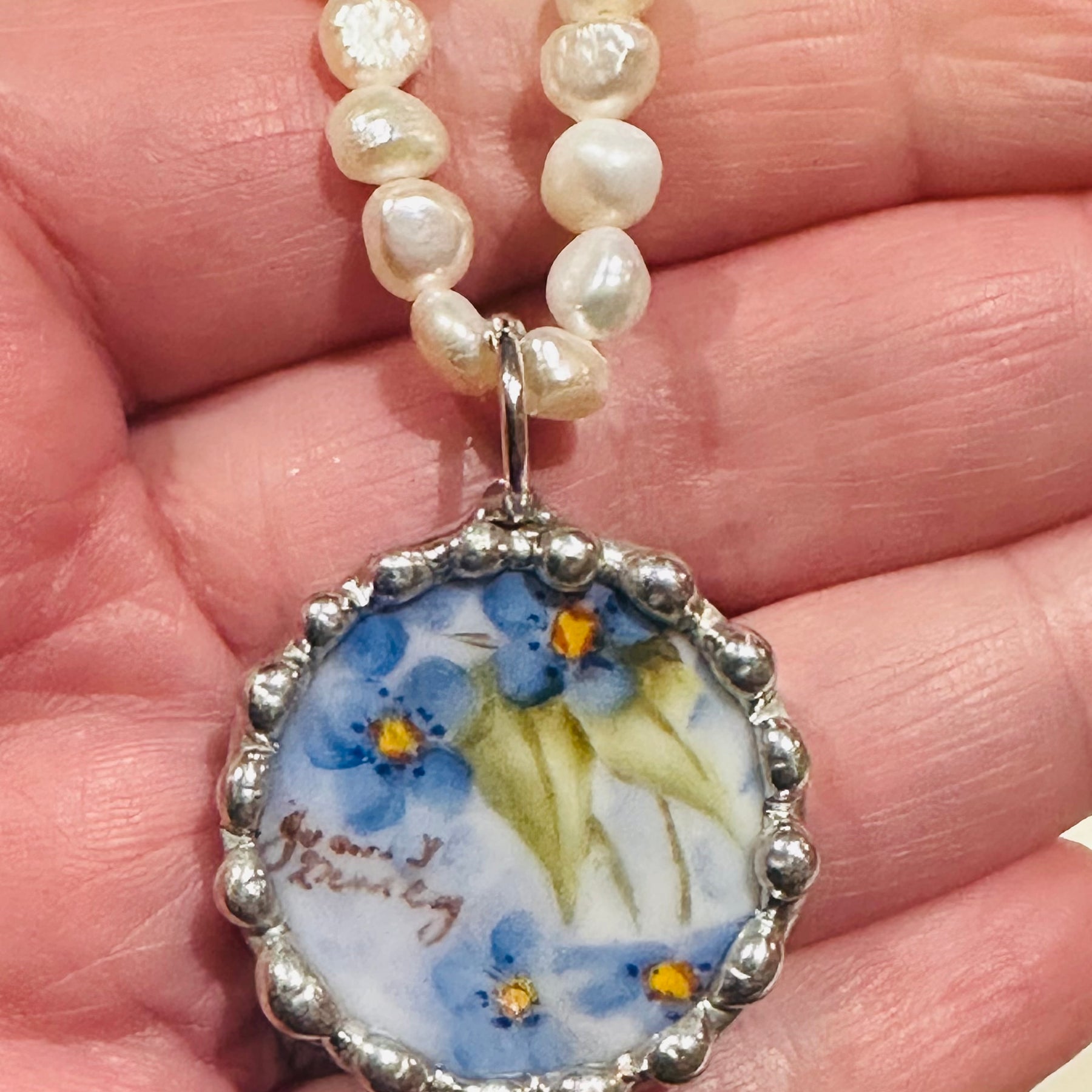 Hand painted blue floral porcelain pendant