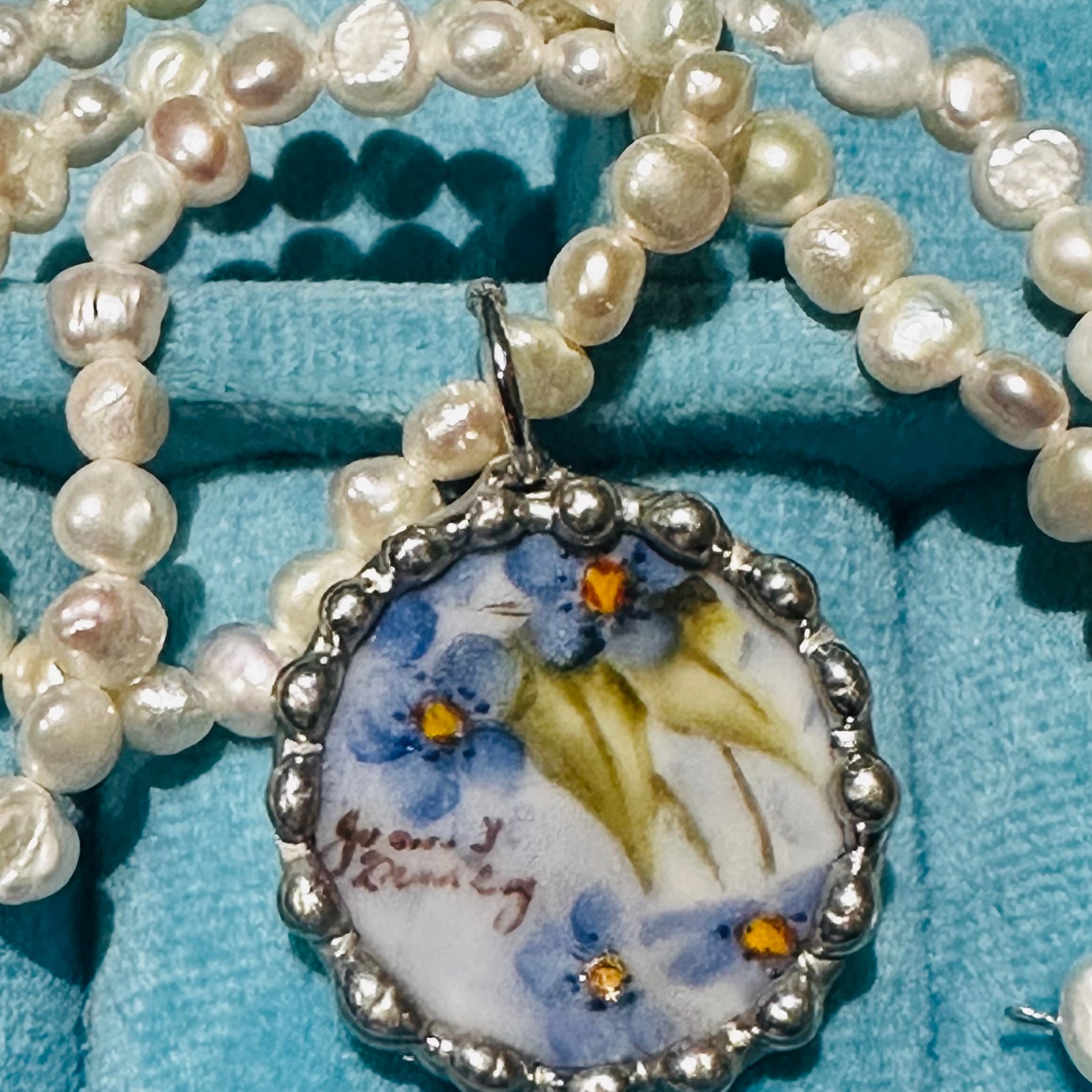 Hand painted blue floral porcelain pendant