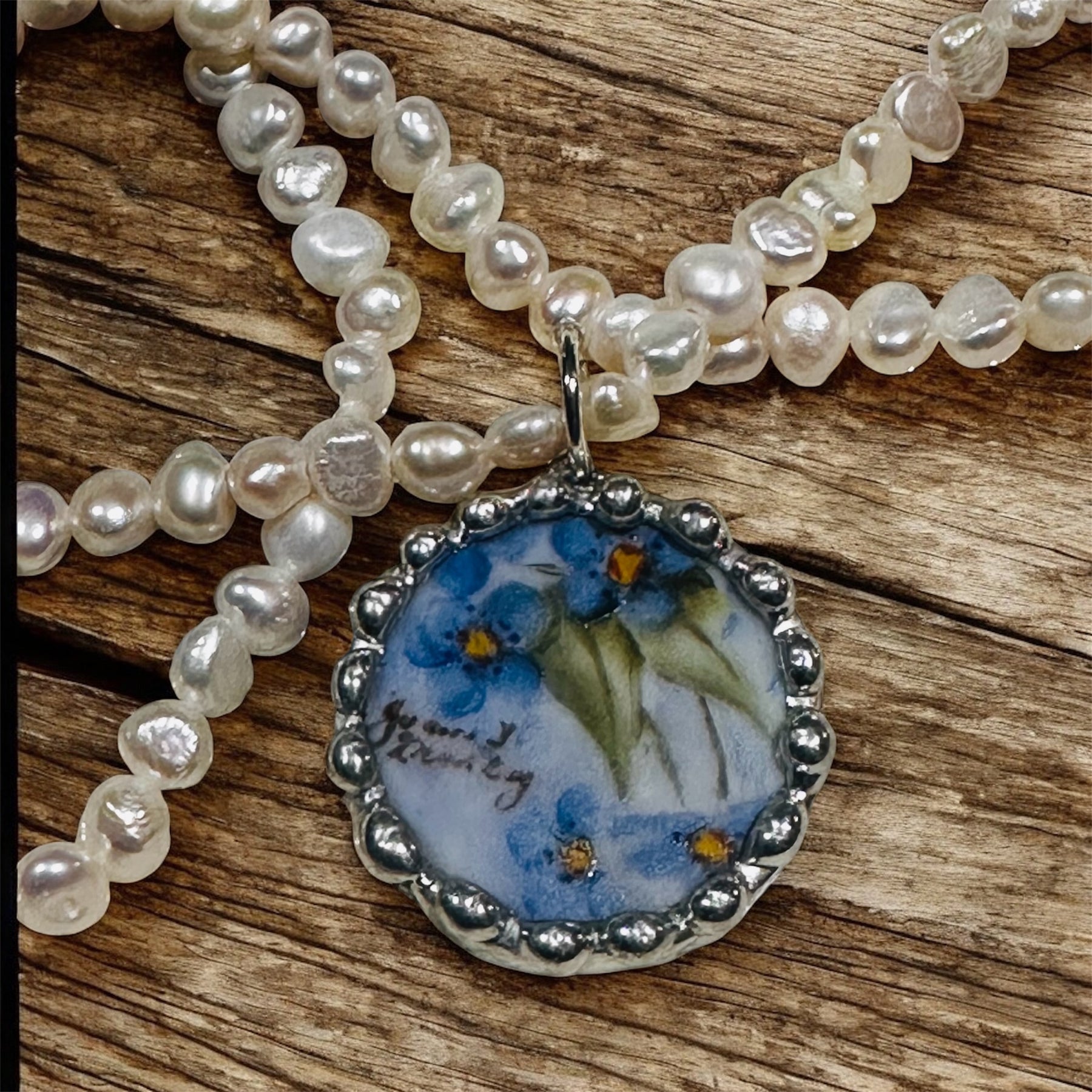 Hand painted blue floral porcelain pendant