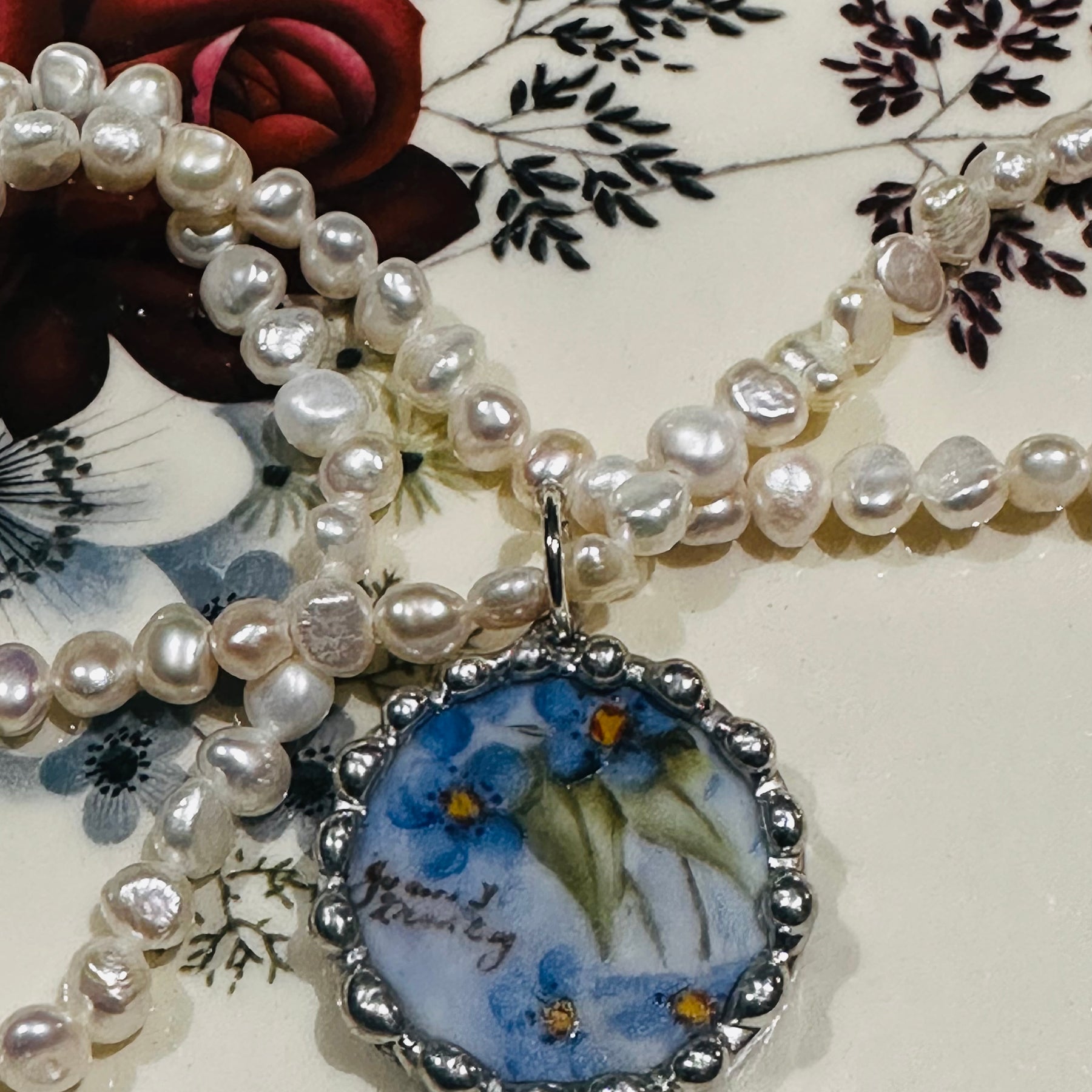 Hand painted blue floral porcelain pendant