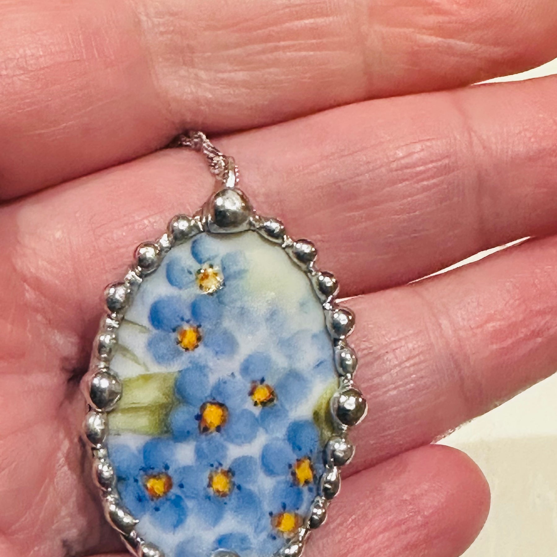Hand painted oval porcelain pendant