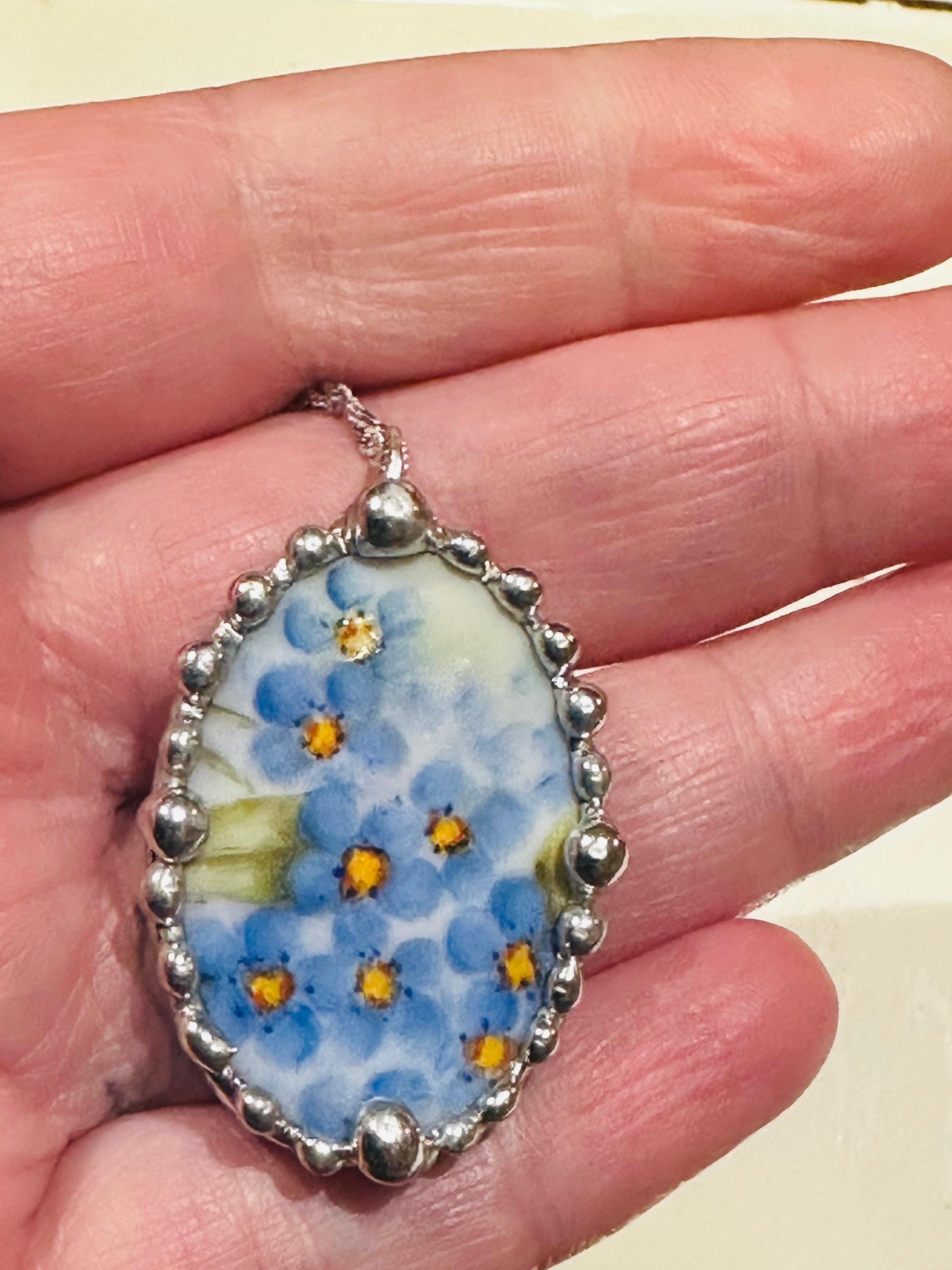 Hand painted oval porcelain pendant