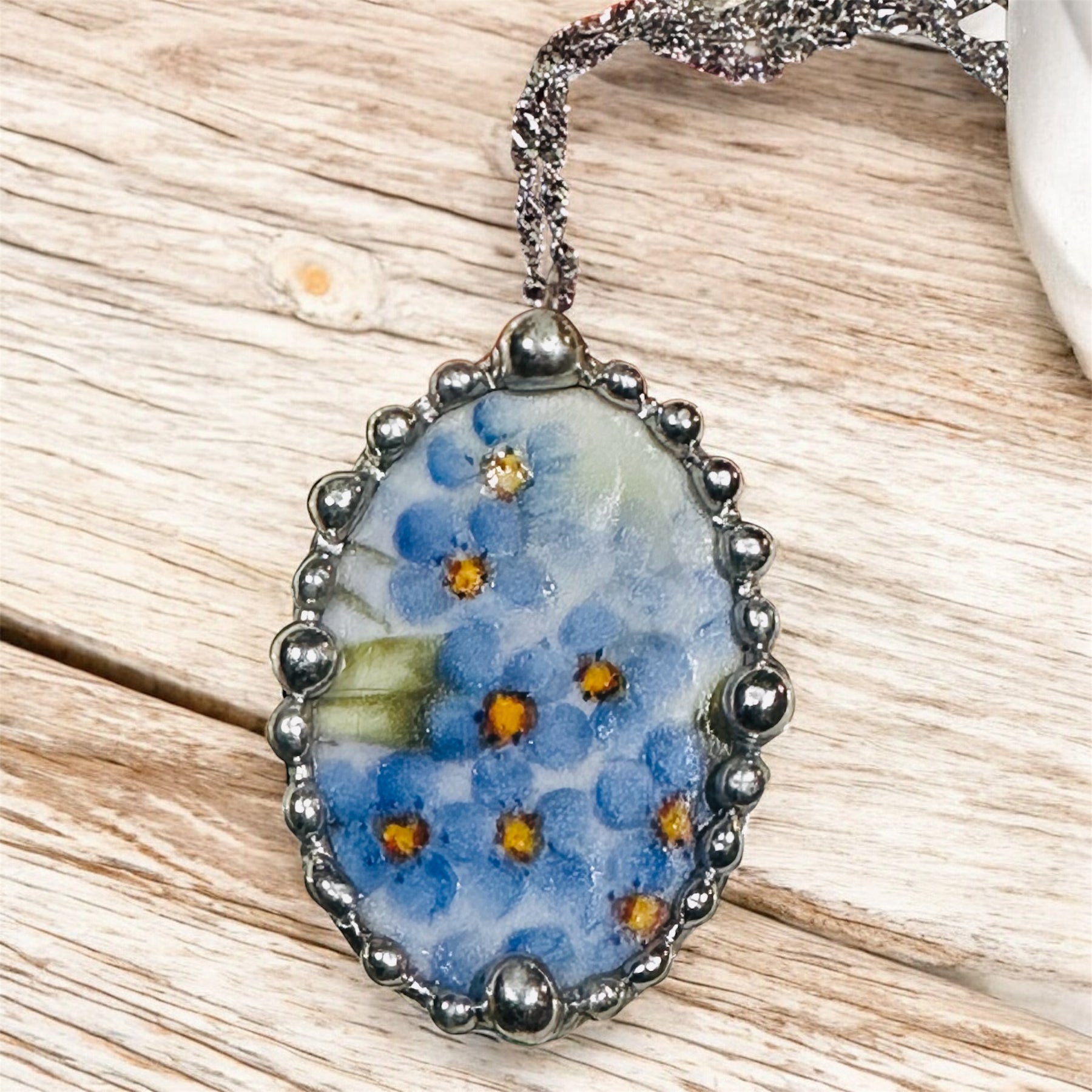 Hand painted oval porcelain pendant