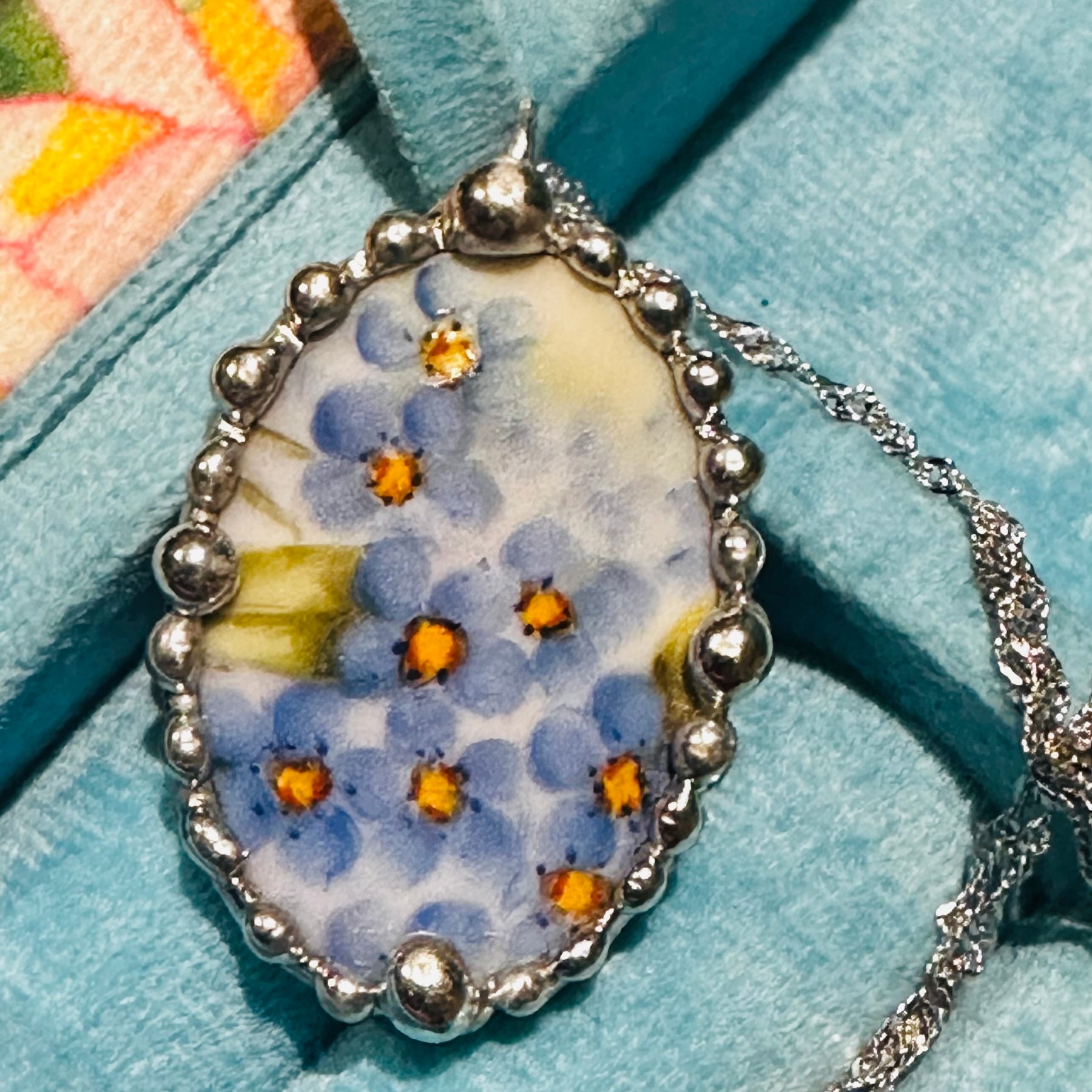 Hand painted oval porcelain pendant