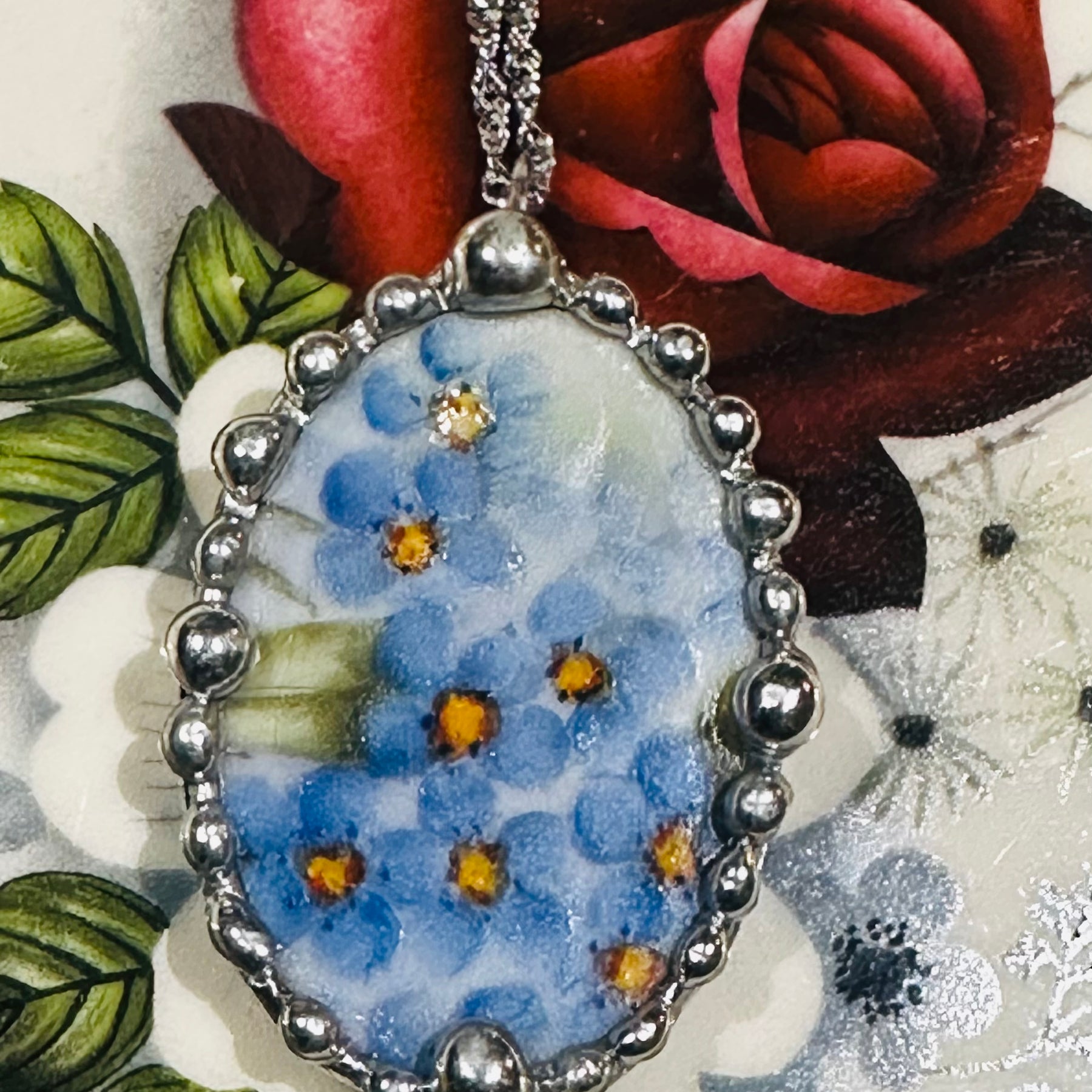 Hand painted oval porcelain pendant