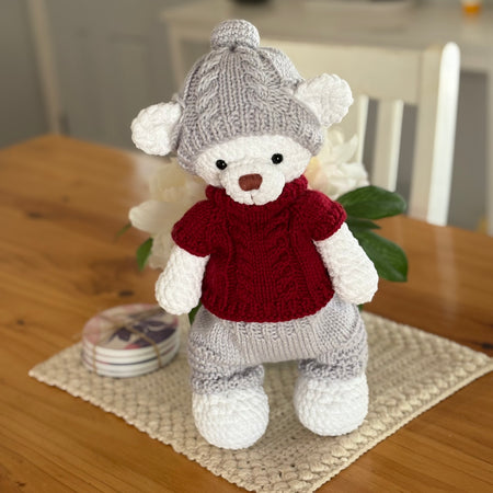 Bear in knitted clothes