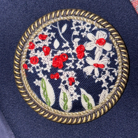Classic navy and white handstitched brooch