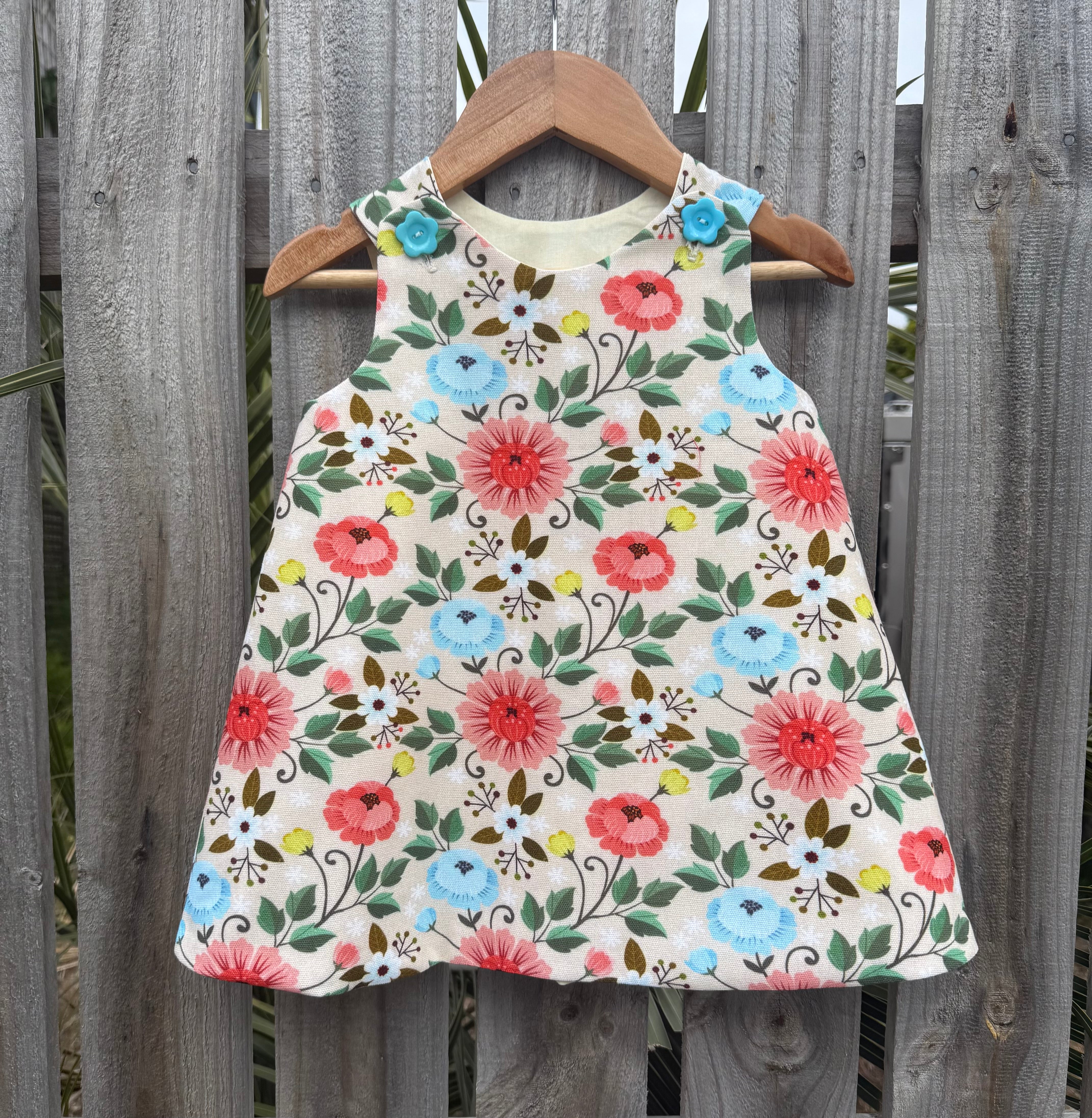 Girls Lotus flower pinafore ,size 2
