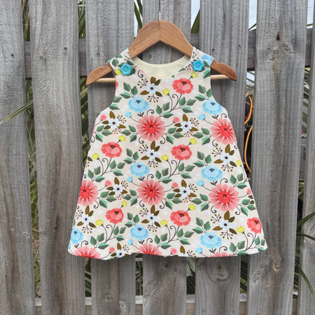 Girls Lotus flower pinafore ,size 2